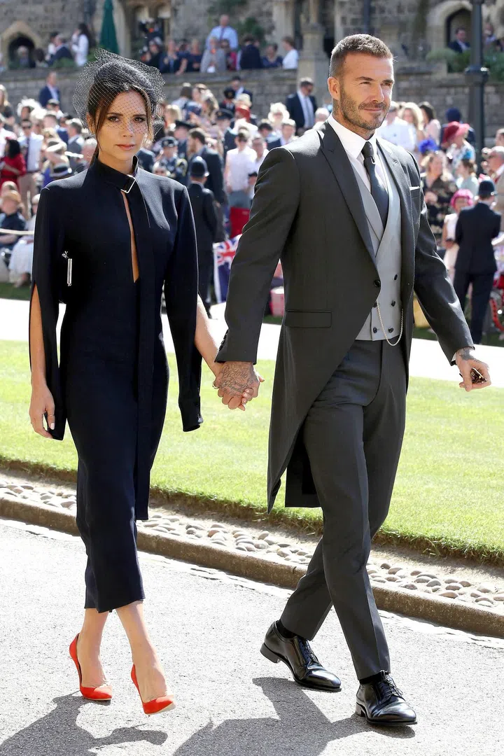 Victoria wears a bespoke dress of her own design; David is in DIor Homme. Photo: Getty