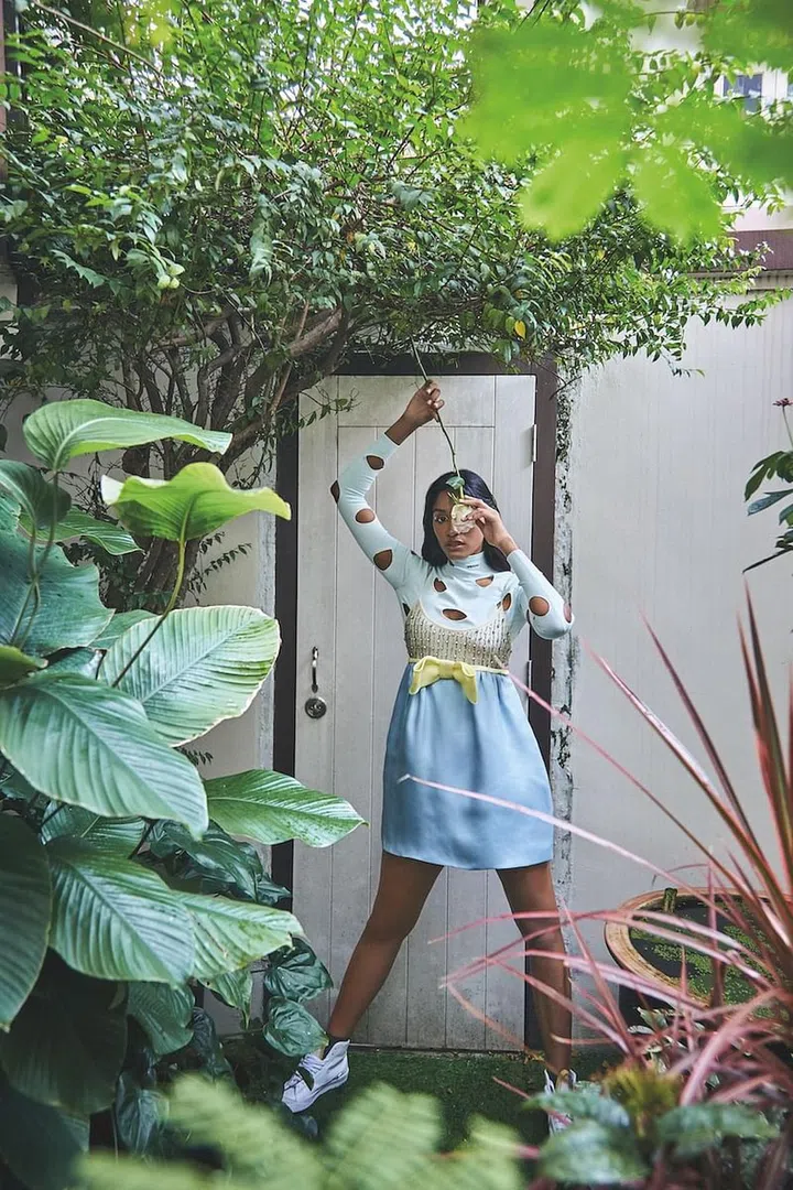 Dress, Miu Miu. Top, Prada. Socks, stylist’s own. Nose ring (worn throughout); sneakers, model’s own. (Photo: Phyllicia Wang)