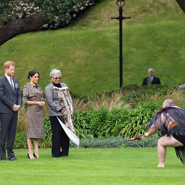 Meghan and Harry attend a traditional welcome at Government House in New Zealand.

Meghan is wearing a Karen Walker Banks plaid trench, with her favorite Sarah Flint pumps. Photo: Getty 