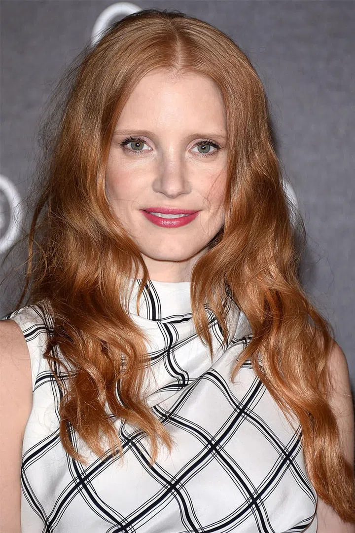 Jessica Chastain's S-wave curls are nicely balanced with a bit of frizz at the roots.