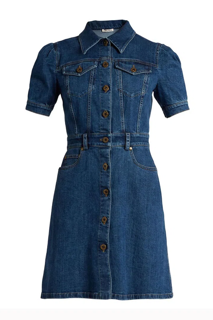 Think a 70s Linda McCartney wearing a denim shirt dress with a pair of espadrilles and a straw bag, or Alexa Chung, who styles hers with opaque tights and black ankle boots. A denim shirt dress is a versatile piece that works hard during summer and winter.
A-line denim dress, £910, Miu Miu at Matches Fashion