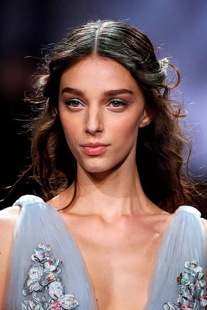 Soft tendrils go hand in hand with dreamy gowns.

Photo: Getty Images