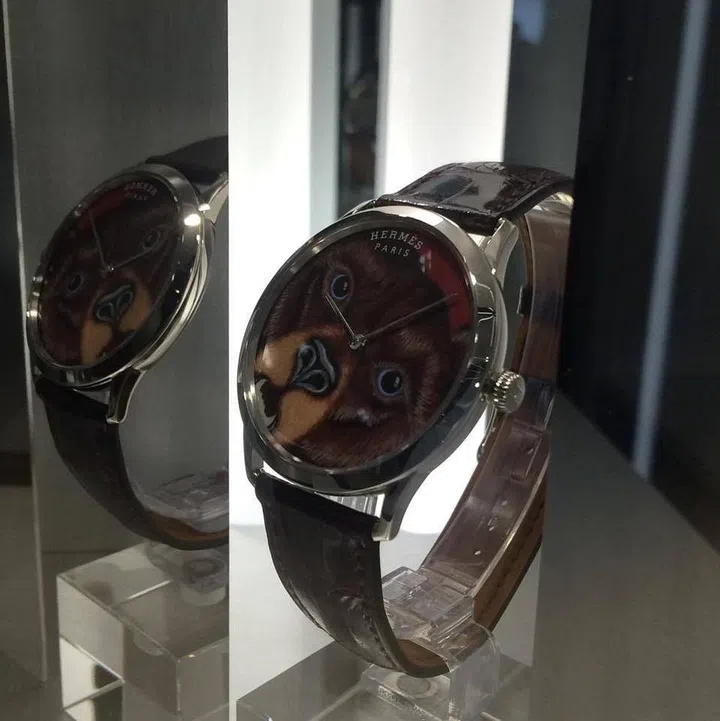 The Slim d'Hermès Grrrrr! watch features a miniature enamel painting of a motif from a Alice Shirley designed Hermès scarf