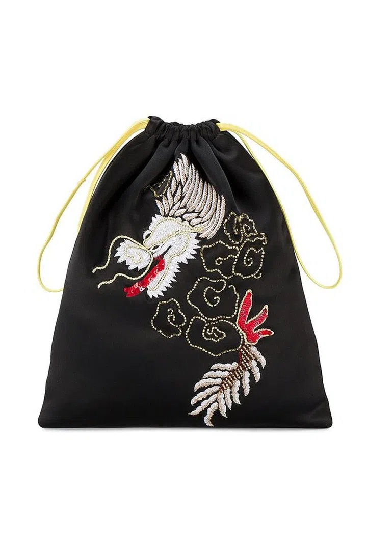 Attico's embroidered drawstring bag fuses both ornateness and sports chic. Its intricate dragon embroidery teamed with its youthful shape make it very desirable indeed.