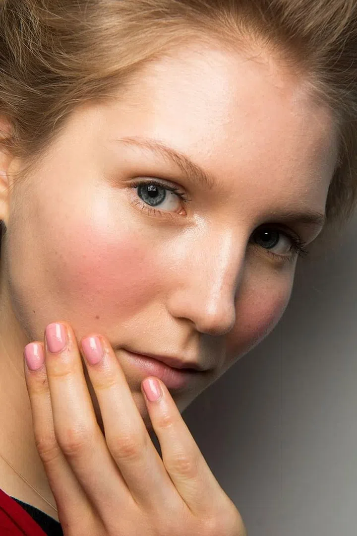 The rosy shade of blush at Reem Acra, applied squarely on the apples of the cheeks, matched a similar shade on the nails.