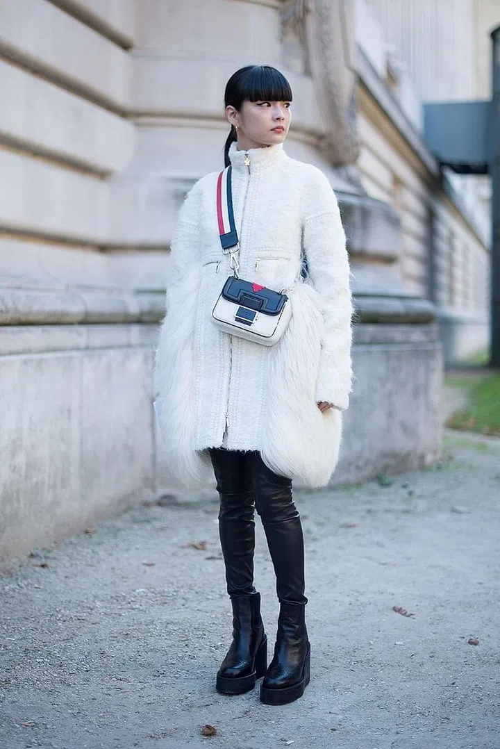 Wearing Moncler Gamme Rouge. Photo: Getty 