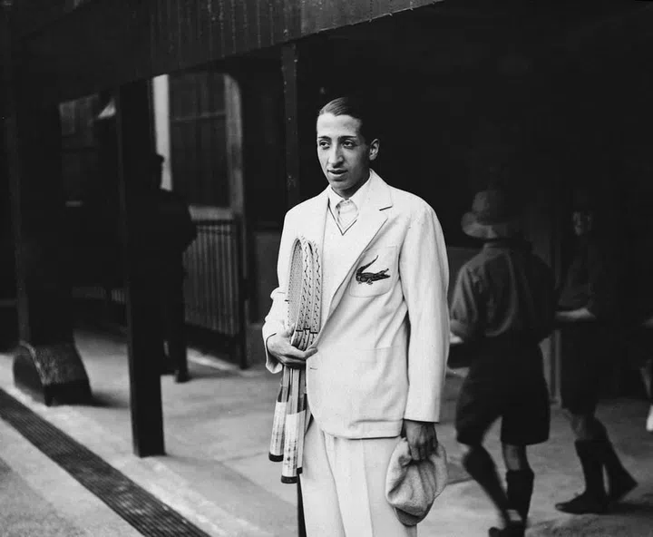 The world champion played up his nickname "the Crocodile," and famously launched his own clothing line featuring the motif. Seen here, after winning the Davis Cup at Wimbledon in 1932
Photo: Getty