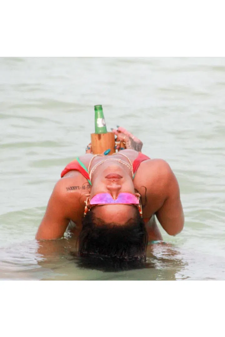In her Rihanna x Dior sunglasses with a beer in hand, photographed by @mdollas11. Photo: Instagram