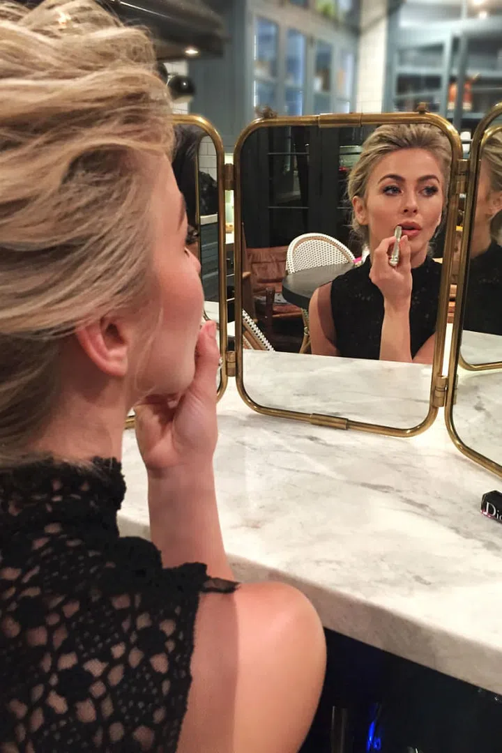 Hairstylist Jill Buck swept Hough's hair into a voluminous, textured updo, while makeup artist Spencer Barnes went for a nude all-over, glowy look. 
