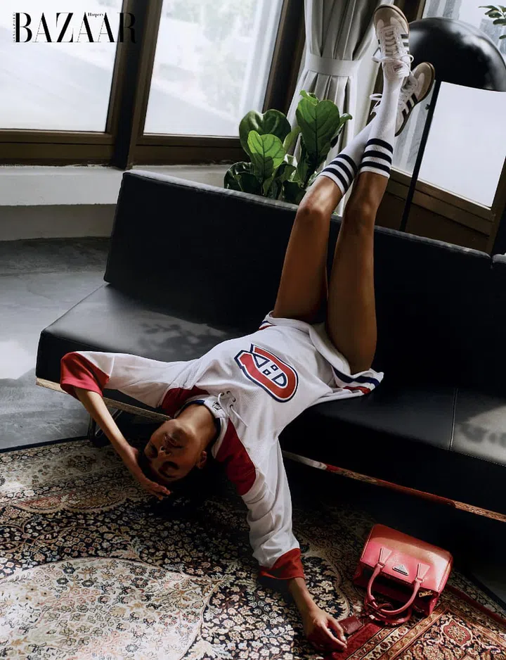 Adidas Samba sneakers, Adidas. Leather bag, Prada. Sports jersey; socks, stylist’s own