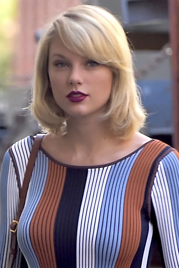 Taylor Swift's new shag cut is often dried straight and rolled inward.