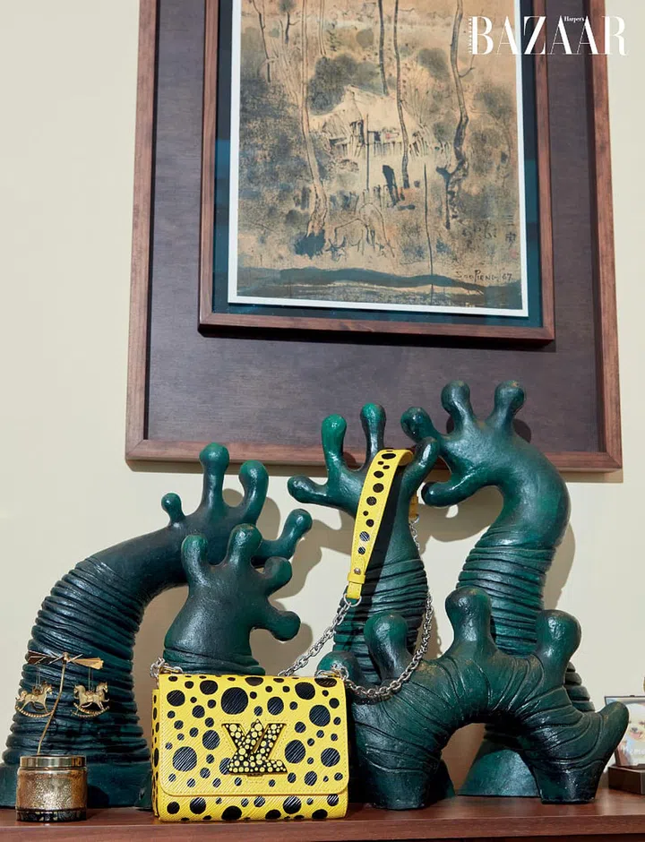 Dr Toh’s Louis Vuitton x Yayoi Kusama bag rests against Han Sai Por’s sculpture Family.