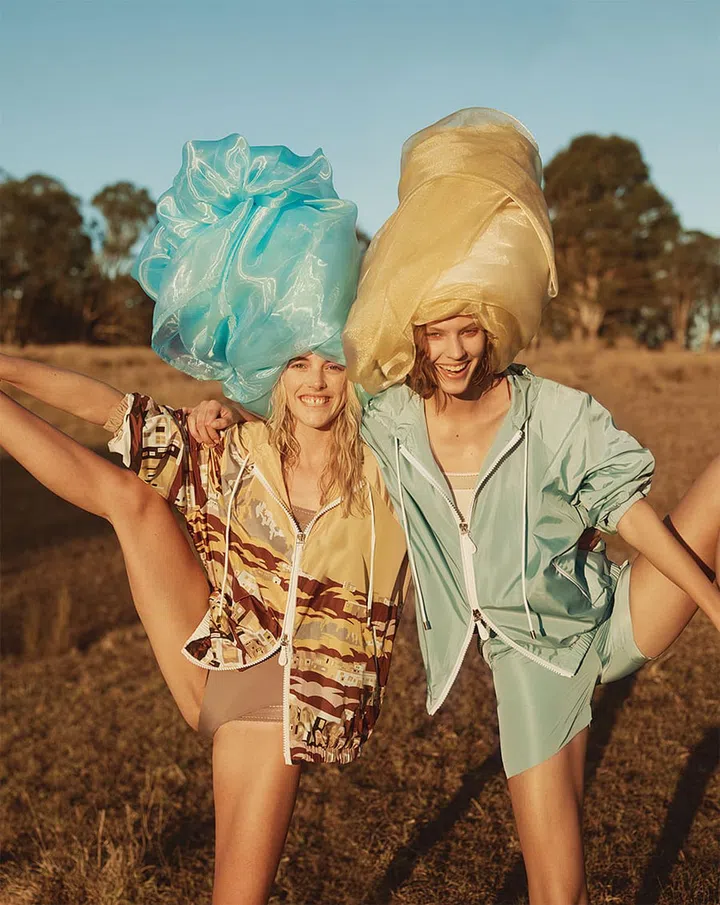 (Left) Nylon jacket, Tod’s. Silk and lace bodysuit, Eres. (Right) Nylon jacket; nylon shorts, Tod’s. Silk and 
lace bodysuit, Eres
