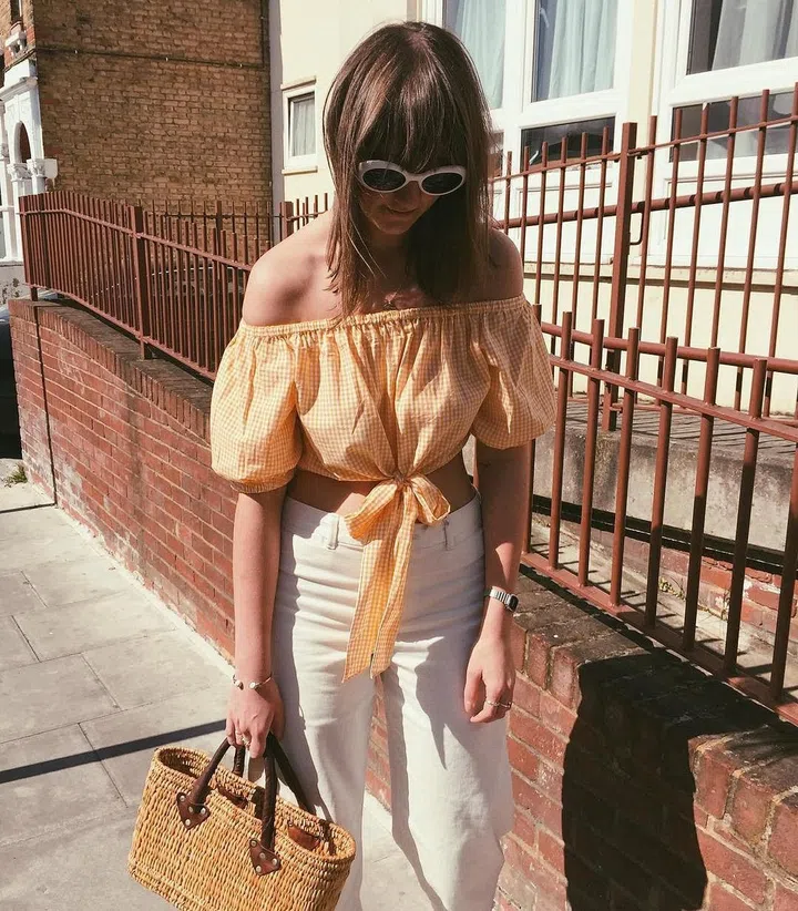 A high-street hit list would not be complete without a piece from Zara – and this off-the-shoulder, gingham crop top will be everywhere come July.