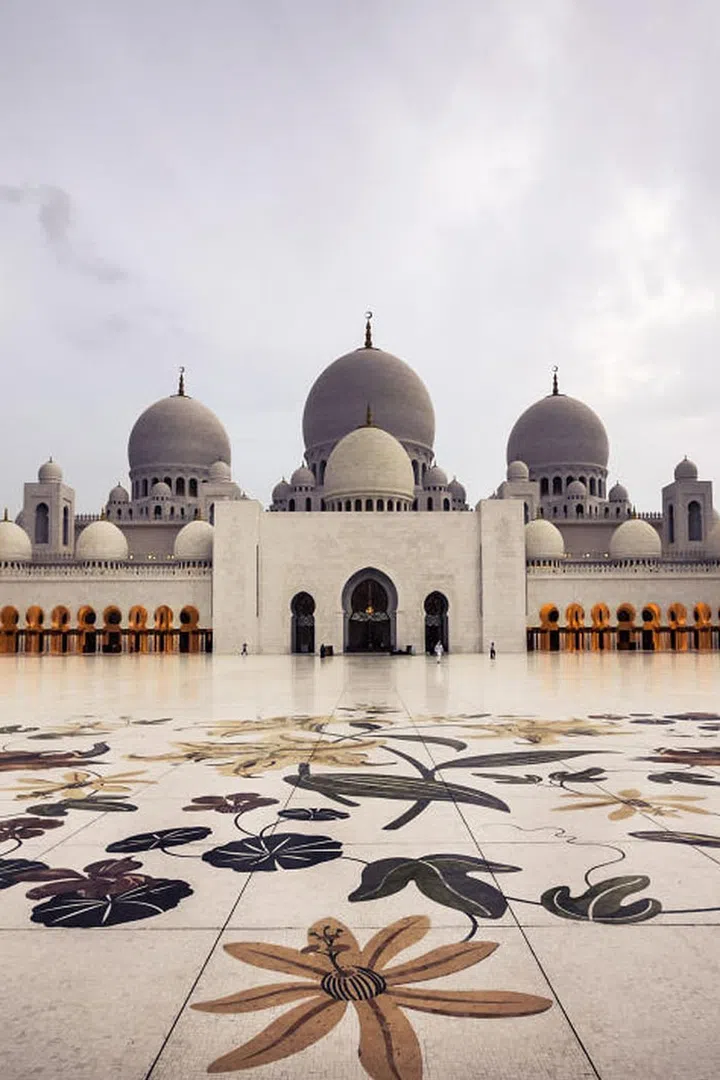 With 82 domes and enough room to accommodate 40,000 worshippers, the Sheikh Zayed Grand Mosque is not only one of the largest mosques in the world but also one of the most beautiful with a marble courtyard featuring mosaics of flowers native to the Middle East.