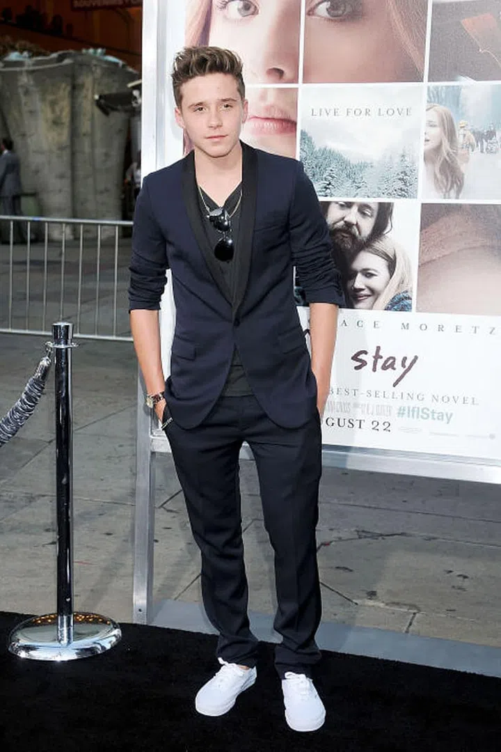 Age: 17
The eldest Beckham son and budding model is an apparent product of his fashion designer mother (an icon herself), and sharply-dressed football star of a father. He easily melds his boyish charm into a tailored look with a pair of trusty sneakers.