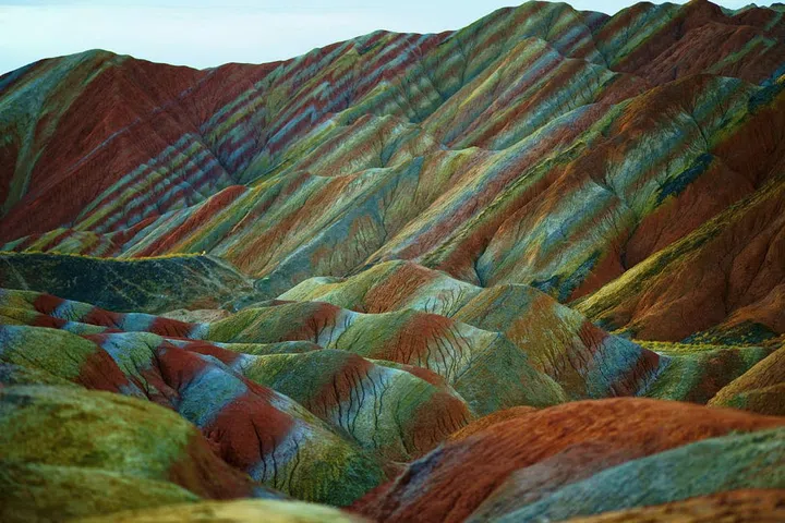 Danxia landscapes are steep cliffs of red rock and they can be found in six areas around the country. Zhangye Danxia is known as the nation's most beautiful, though, with its uniquely shaped, multicolored rock face.
