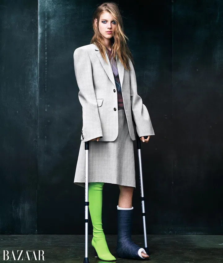 Vetements blazer, top, skirt, and boot.
