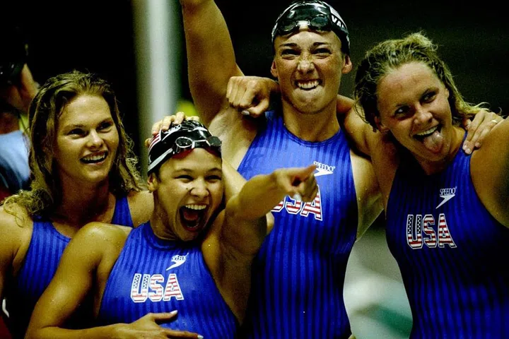 Team USA swimmers celebrating a gold medal win in Atlanta, Georgia. Speedo introduces a fabric made from chlorine-resistant polyester/spandex this year. Photo: Getty