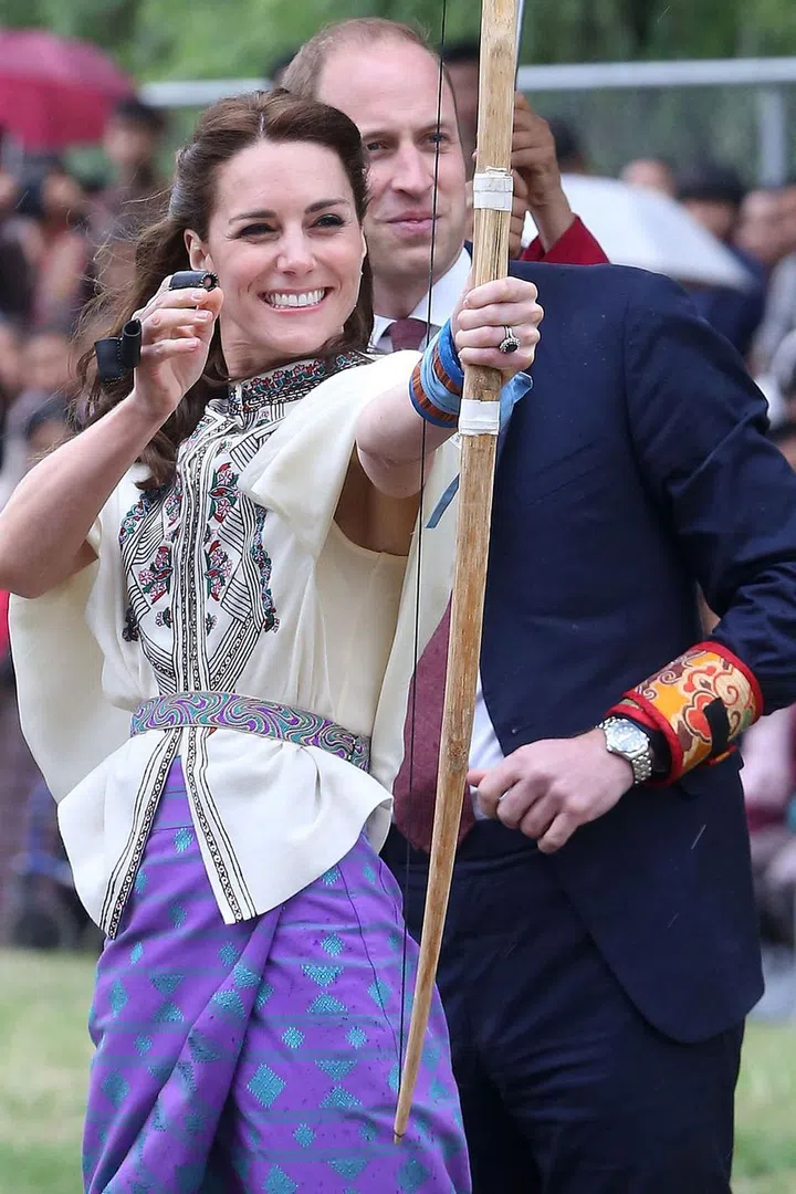 Go Kate go! The Duchess takes a shot at archery in Thimphu, Bhutan.
Photo: Getty