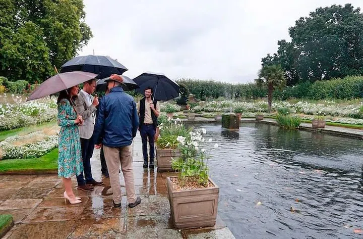 Head Gardener Sean Harkin leads the royals on a walk around the grounds. Photo: Getty 