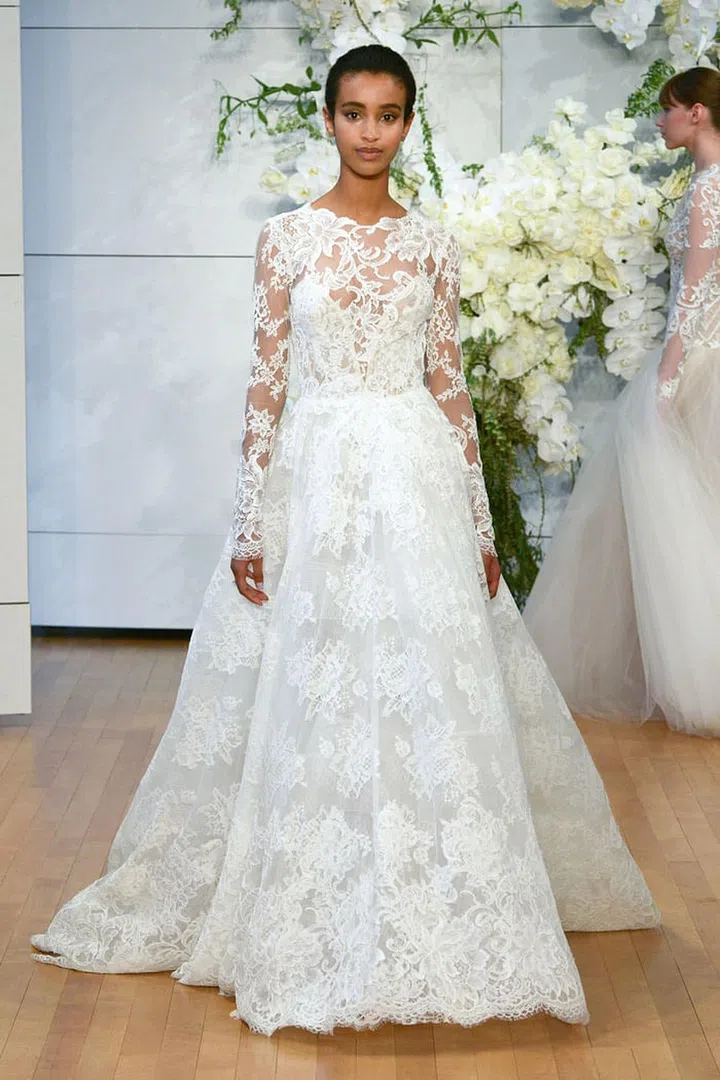 Gowns that may feel to conservative in a ballroom, like all-over-lace with to-the-max coverage, will likely be softened by the sublime setting of a vineyard, mountain top or country church. Monique Lhuillier "Sistine" gown, moniquelhuillier.com. 