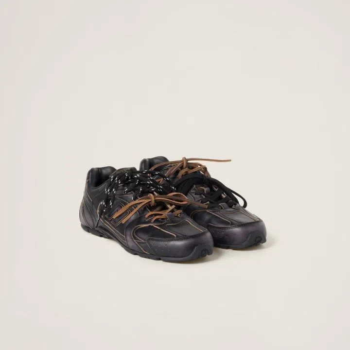 Christmas gift guide 2024 travel fashion Miu Miu New Balance black leather sneakers