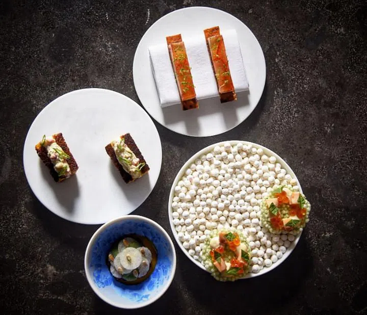 Meta’s amuse-gueule:(clockwise from top) crispy potato flatbread with foie gras mousse, verjus jelly and Korean strawberries; sago chip with garlic aiole, octopus and ikura; Korean-style beef tartare with nashi pear and sunflower seeds; Kombu Brioche with lobster salad.

Photo: Courtesy