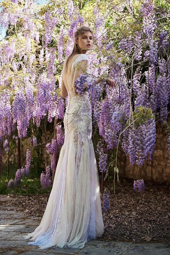 Mermaid silhouettes only work for low-key settings when the shape is softened up- like this easy tulle godet skirt paired with  a form-fitting lace bodice. Costarellos BR18-36, costarellos.com. 