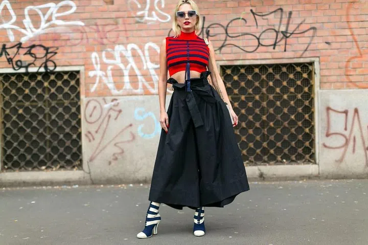 Caroline Vreeland goes '50s style in a cropped mock turtleneck and full black skirt. Photo: Diego Zuko