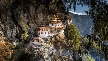 Scott Dunn’s off-beat itinerary includes hiking to the famous Tiger’s Nest Monastery perched on the side of a mountain in Bhutan.