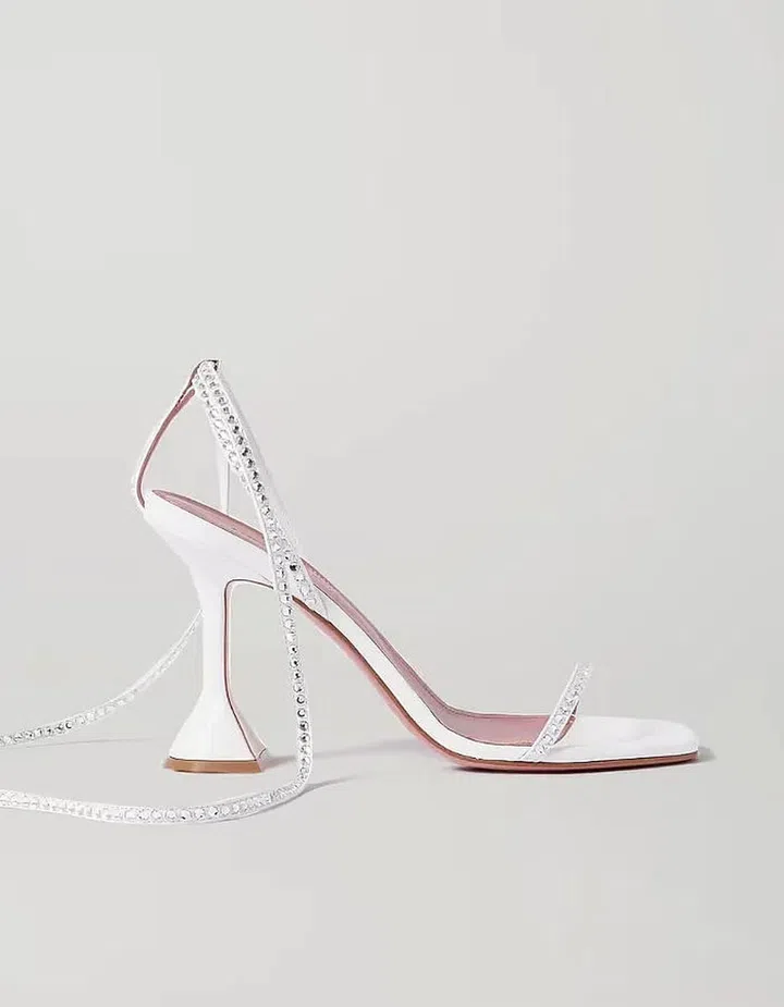 Vita Crystal-Embellished Leather Sandals, $1,197, Amina Muaddi at Net-a-Porter