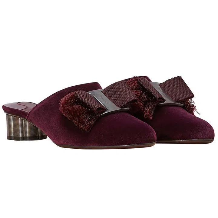 Salvatore Ferragamo mules, $561, www.24serves.com.