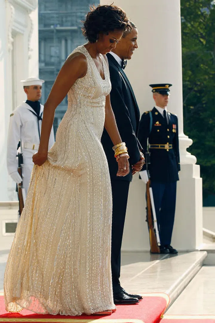 The first lady dazzles in a beaded ivory gown, again by Naeem Khan.