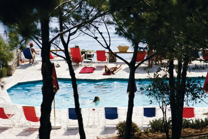 Sitting poolside with a seaview at the Hotel Il Pellicano. Photo: Courtesy of Hotel Il Pellicano
