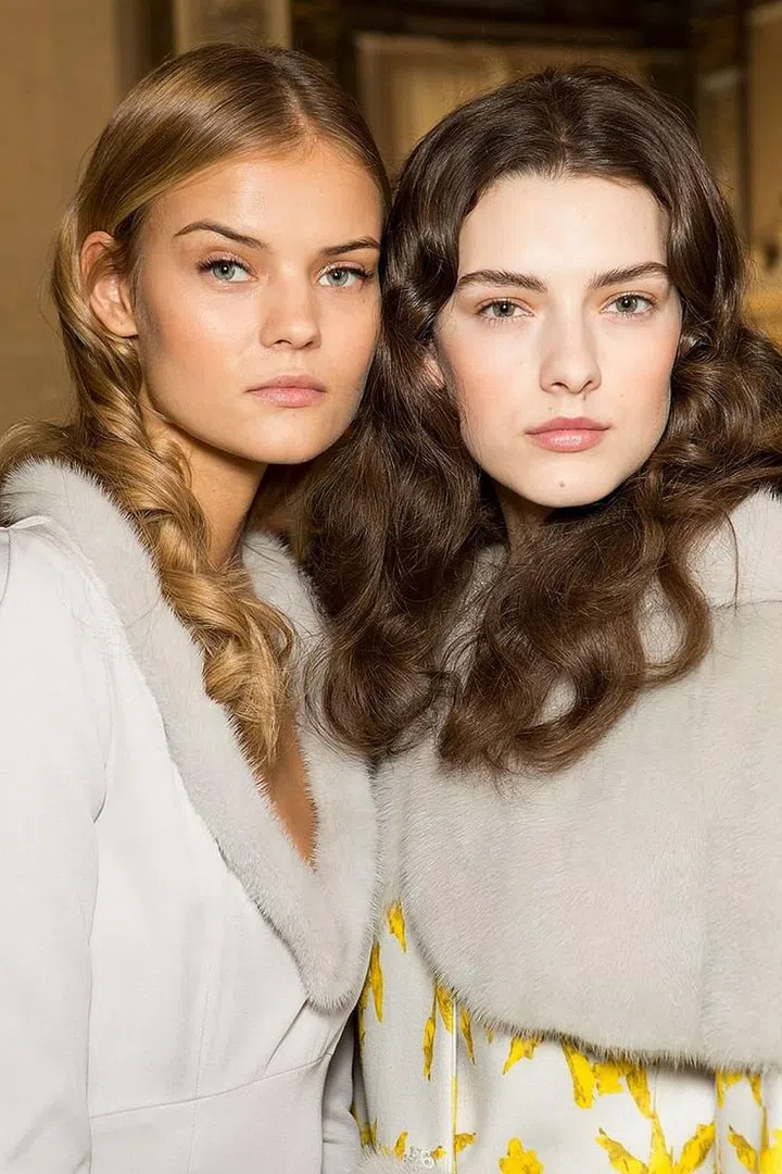 The hair at Bluemarine was set into curls and then meticulously brushed-out, resulting in this cloud-like volume.