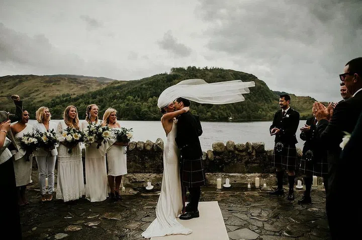 Skip the tropics and the barns. As an alternate wedding destination, rendezvous to the countrysides of the United Kingdom, where autumn is at its best. In the hills of Scotland, you’ll find moody landscaped views of rolling hills and stone castles. In the English countryside, prepare for a more rustic vibe–but with a polish–or go glamorous with a historic Irish castle. Think Game of Thrones with a modern, romantic twist. You won’t regret opting for a lush or historic setting for your autumnal celebration.

Photo: Getty