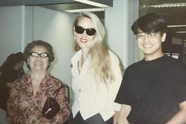 (From right) Kenneth Goh pictured with supermodel Jerry Hall and his grandmother at Heathrow airport in 1990. (Photo: Kenneth Goh)