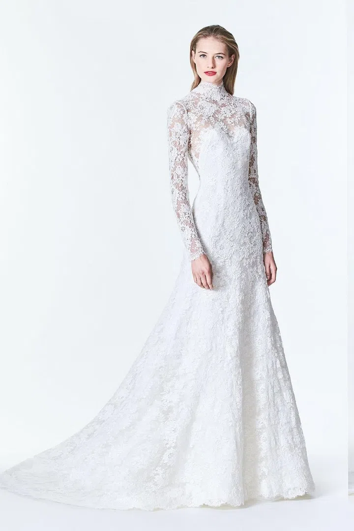 Mrs. Herrera has long been a go-to for classic silhouettes imbued with elements of mystery and grace. This fit and flare style from her Fall 2017 range is a more fitted, slim version of Pippa's look with some extra coverage to balance out its body-con feel. Given Pippa's bodycon look at her sister's wedding, we would have guessed that she'd choose something in this vein for her wedding to James Matthews–and in many ways, she did.

Carolina Herrera Fall 2017 Look 3, price upon request, carolinaherrera.com