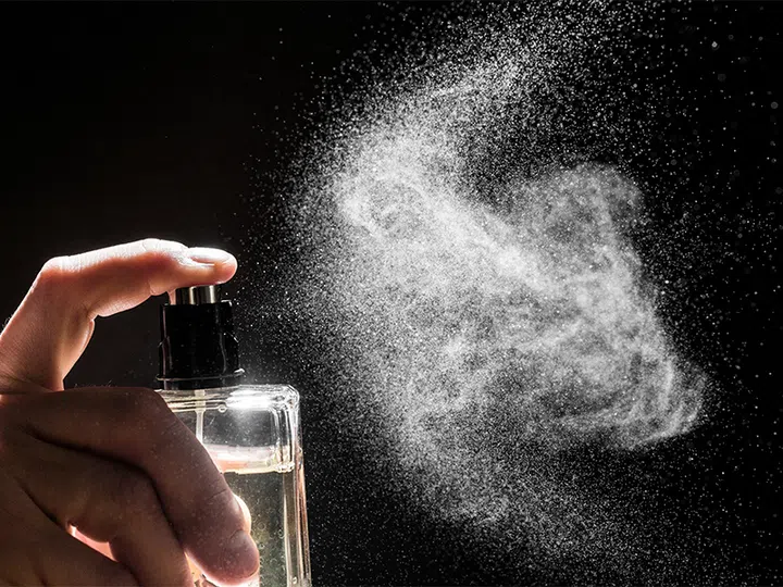 perfume spraying into air | Harper’s BAZAAR’s Ultimate Jewellery Cleaning And Storage Guide