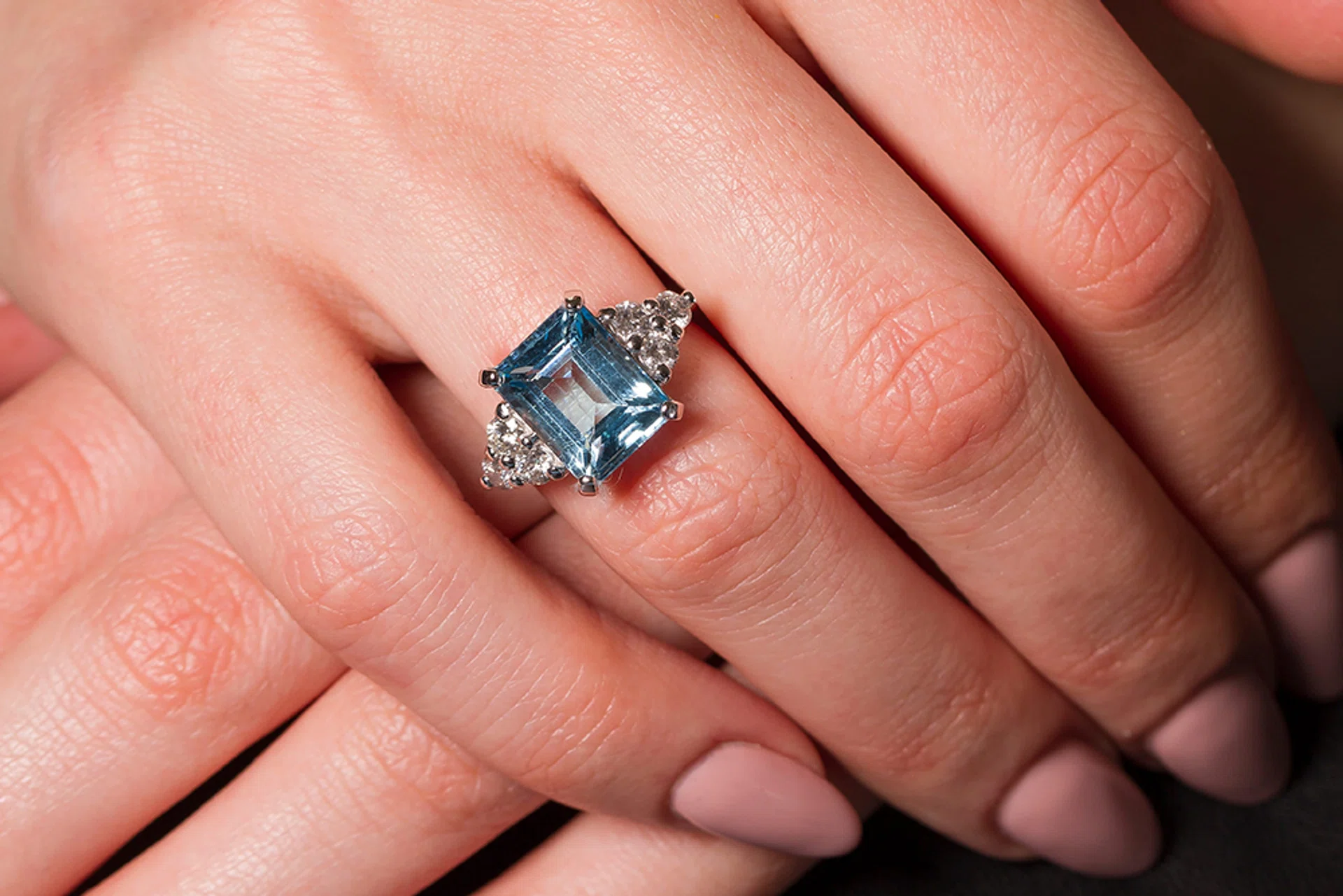coloured gemstone engagement rings | aquamarine on women’s finger