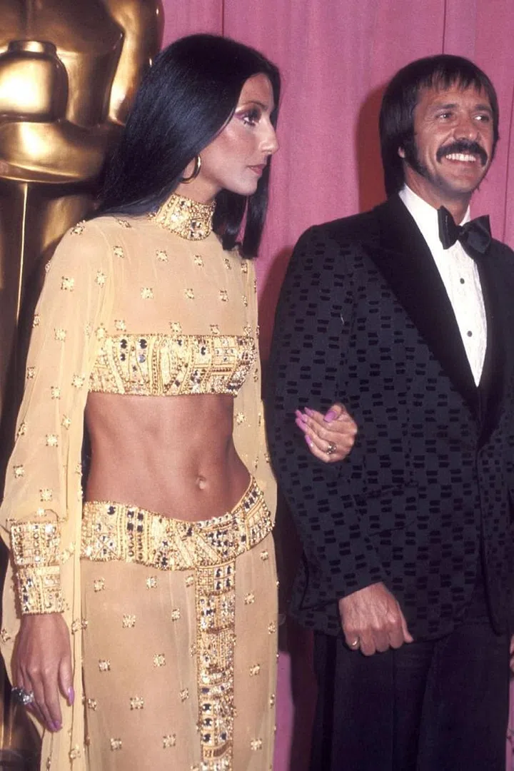 5 Years later, Cher made her return to the awards show in a gold, jewel-encrusted Bob Mackie look, hoop earrings, pink dagger nails and abs that could rule their own country. She wasn't even nominated for an award, but she still won the whole damn show. Photo: Getty 