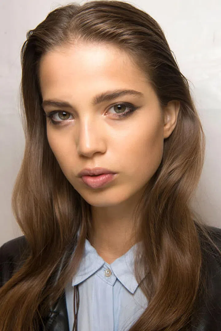 At Elie Saab, black eyeliner was traced half-way across both lashlines and then winged out at the corners.
