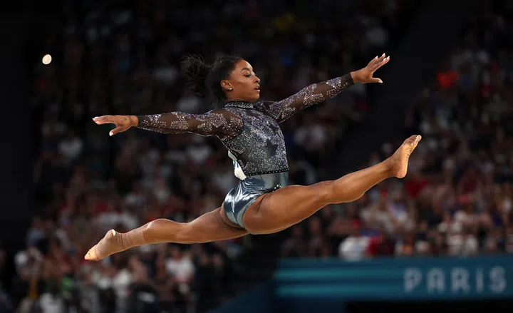 PARIS, FRANCE - JULY 28: Simone Biles of Team United States competes in the floor exercise during the Artistic Gymnastics Women's Qualification on day two of the Olympic Games Paris 2024 at Bercy Arena on July 28, 2024 in Paris, France. (Photo by Jamie Squire/Getty Images)