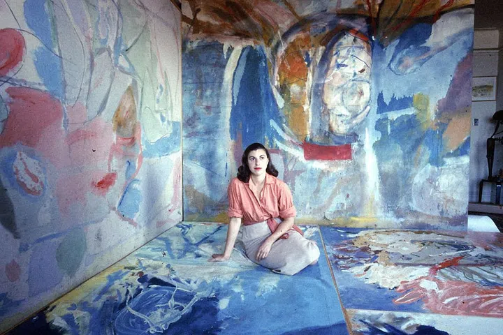 Helen Frankenthaler's breakthrough "stain" painting Mountains and Sea from 1952 played a pivotal role in the transition from the grandiose gesture of Abstract Expressionism to the flat, meditative forms of Color Field painting. First and foremost a colorist, Frankenthaler poured cans of paint onto raw canvas, allowing the material to soak into the support, forming amorphous shapes. As a woman of Abstract Expressionism, Frankenthaler broke through the masculine-dominated movement and let her own unique artistic voice be heard. Her work is currently part of a long overdue exhibition titled the "Women of Abstract Expressionism," which opened at the Denver Art Museum in June 2016 and will travel to the Mint Museum in Charlotte and the Palm Springs Art Museum.
Pictured: Helen Frankenthaler c. 1956