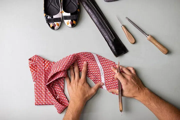 A printed silk tie from the brand’s stock being taken apart. (Photo: Salvatore Ferragamo)