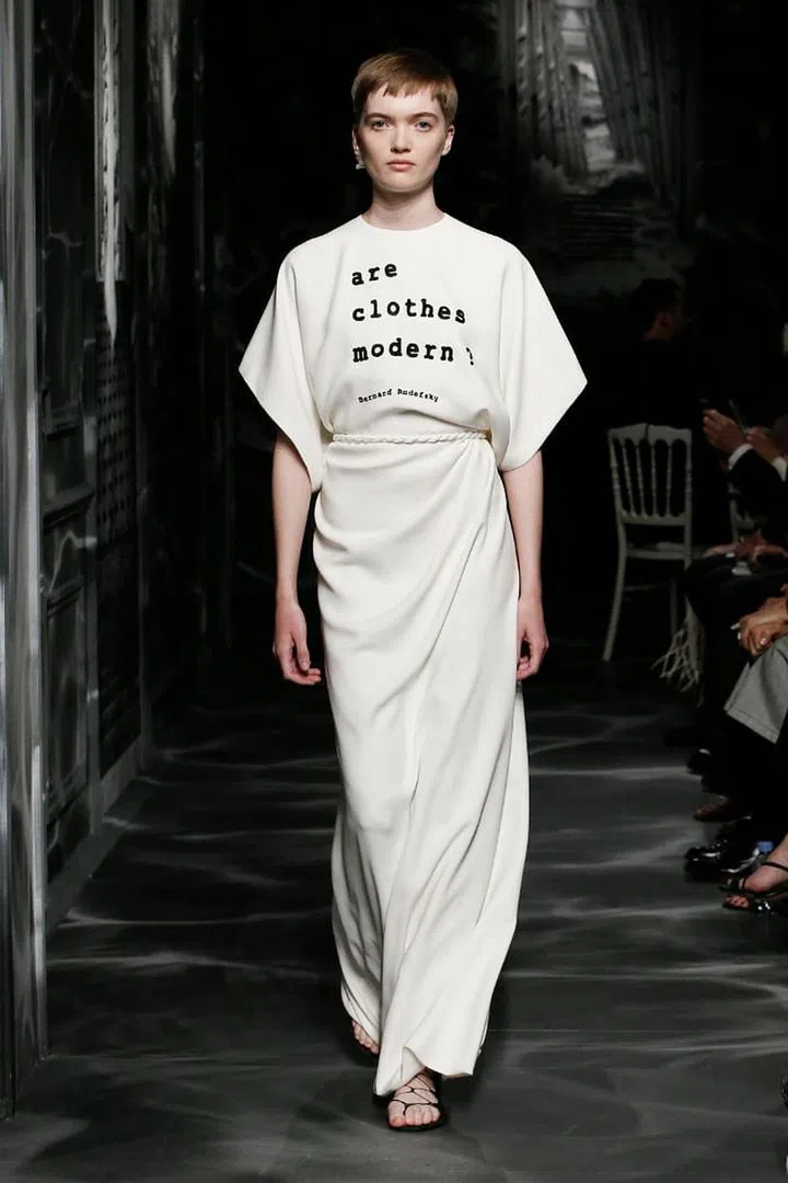 Maria Grazia Chiuri’s starting point was Bernard Rudofsky’s landmark 1944 exhibition at the Museum of Modern Art, “Are Clothes Modern?”, which explored the relationship between people and the garments they wore. The architect’s musings on the form and function of clothing led Chiuri to the idea of fashion as architecture for the body. Her main focus this season was therefore on construction, explored in the myriad ways she draped and sculpted cloth to the human form, which she further veiled and revealed with layers of opaque and sheer fabrics. The collection itself was executed almost entirely in black, allowing cut and silhouette to take centre stage. As Monsieur Dior himself said about the timeless hue: “It is the most fl attering. I could write a book about black.” Taking his words to heart, Chiuri wrote a bewitching new chapter for the House.

Photo: Courtesy