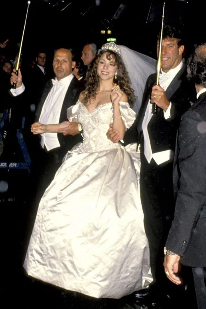 In a lavish affair on June 5, 1993, singer Mariah Carey married Sony Music's Tommy Mottola wearing a massive $25,000 Vera Wang gown with a 27-foot-long train. That's right, 27 feet of fabric. The couple divorced just four years later.