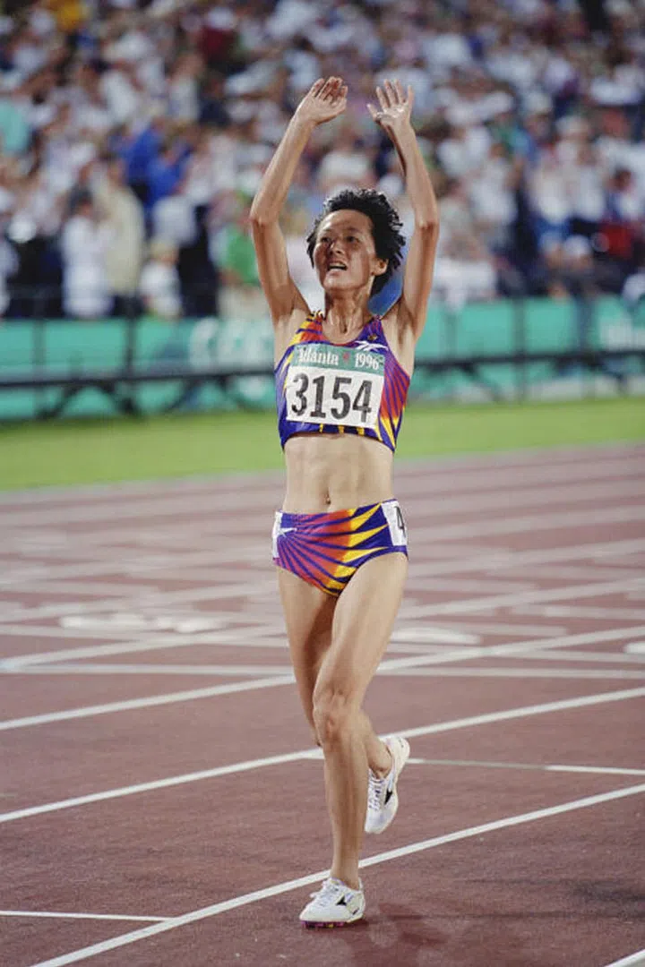 Chinese long-distance runner Wang Junxia celebrates her win at the women's 5000 meter event in Atlanta, Georgia. Photo: Getty