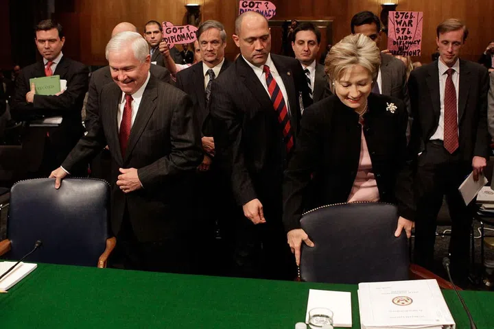 Got a meeting at the conference table with a bunch of your superiors? Resist the urge to be polite by confining your notebook, water, iPhone, etc to the smallest possible space. Instead, spread out (within reason). "We broaden our territory when we're confident," says Navarro, suggesting that to create the illusion of confidence, "put your notepad on the right with your folder neatly next to it, instead of everything piled on top." Photo: Getty
